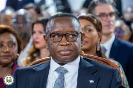 His Excellency Julius...