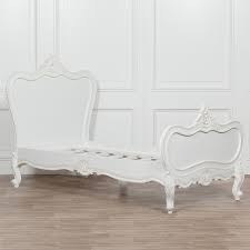 White, single bed frame with thick legs guarantees proper stability for many years. 3ft French White Chateau Wooden Single Bed Furniture La Maison Chic Luxury Interiors