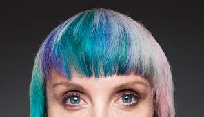 The underlying shades of red and purple create a new look on the black hair, although the main focus rest on the purple color. Rainbow Hair Colors Workin It At Any Age