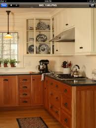 White Uppers With Cherry Lower Cabinets Kitchen Cabinets Color Combination Kitchen Remodel Small Kitchen Remodel Layout