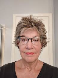 Should I continue growing my hair or leave it short?