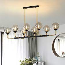 What is a kitchen island pendant light? 8 Bulbs Bedroom Island Light Modern Black Gold Pendant Lighting Fixture With Orb Amber Glass Shade Beautifulhalo Com