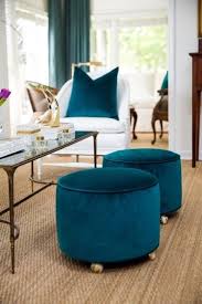Upholstered Stools Are On Casters For Easy Movement Turquoise Living Room Decor Upholstered Stool Living Room Turquoise