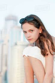 She has very rich parents and lives in a mansion. Preteen Girl Sitting Outdoors Portrait Stock Photo Dissolve