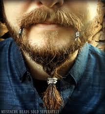 Viking haircut styles are often all about long, thick hair on top with short or shaved sides. Celtic Viking Beard Styles