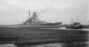 The white ensign in german waters. Battleship Bismarck Passing Through The Kiel Canal On Her Way Back To The Blohm Voss Shipyard On December 7 1940 1366x722 Warshipporn