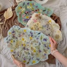 Maybe you would like to learn more about one of these? Resin Crystal Trays Preserve Real Flowers Inside Their Glossy Surfaces