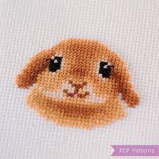 A teeny tiny bunny cross stitch pattern, poking his head up from the bottom of the frame. Bunny Cross Stitch Pattern Pdf Bundle Bunny Lop Eared Bunny Instant Download Small Cross Stitch Patterns Cross Stitch Cross Stitch Animals