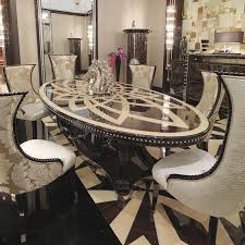 To use this setting, you arrange a placemat on the table and top it off with a dinner plate right on the center. 15 Astonishing Oval Dining Tables For Your Modern Dining Room Modern Dining Tables Glamourous Dining Room Luxury Dining Room Modern Dining Table