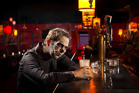 PHOTO ILLUSTRATION SAD ZOMBIE IN BAR DRINKING