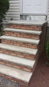 Wooden stairs down a hill. New Beautiful Brick Stairs But Is It Code Compliant See Picture
