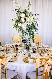 Glam Reception Table Photo By Carla Atley Photography Http Ruffledblog Com Glam Gatsby Art Deco Wedding Centerpieces Art Deco Wedding Flowers Wedding Deco
