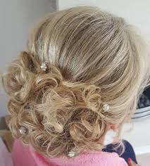 Women over 40 can wear many different types of long hairstyles that range from braids, buns, updos, waves and curls, to name a few. 50 Ravishing Mother Of The Bride Hairstyles