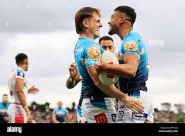 The Titans celebrate a Alofiana Khan-Pereira try during the NRL Round 2  match between the St. George Illawarra Dragons and the Gold Coast Titans at  Netstrata Jubilee Stadium in Sydney, Sunday, March