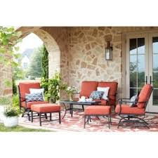 Hampton Bay Laurel Oaks 4 Piece Brown Steel Outdoor Patio Conversation Seating Set With Standard Putty Tan Cushions 505 0370 000 The Home Depot Deep Seating Blue Cushions Patio Seating Sets