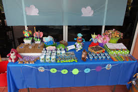Set up an inflatable pool slide & floaties, a water table with water balloons or a trampoline, swing set & slip & slide for fun outside. Toy Story B Day Party Can T Find Original Link But Love This Table Set Up Toy Story Party Toy Story Cookies Trendy Toys