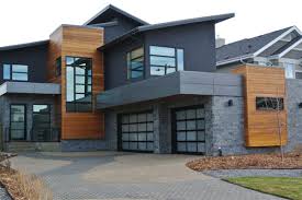Ashlar Stone Veneer Adds Drama To The Exterior Of This Contemporary Design Modern House Exterior Stone Exterior Houses House Designs Exterior