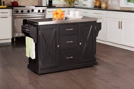 The table can hold up to 1,100 pounds and the bottom shelf can support 250 pounds. Brigham Kitchen Island In Black With Stainless Steel Top By Hillsdale Furniture Nis100681982 Sylvan Furniture