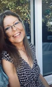 My husband's Mom died recently. It was hard to find a picture of her  smiling, but apparently, a Sanders hot fudge cream puff made her happy! We  actually plan to incorporate this