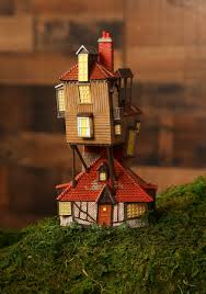 It features a 3d puzzle of the weasley's house. Harry Potter The Burrow Statue From Department 56