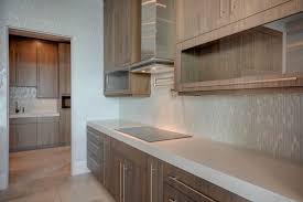 Kitchen Design With Large Format Porcelain Tile Flooring Quartz Countertops Glass Mosaic Backspl Glass Mosaic Backsplash Kitchen Design Contemporary Cabinets