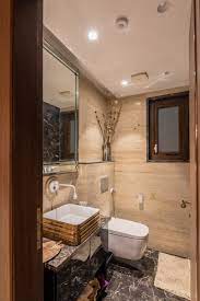 The budget small bathroom remodel replaced the old flooring, pipes, tub, and vanity to make it more functional for a young family. Bathroom Design Experts Revel Ways To Design This Space On A Budget Architectural Digest India