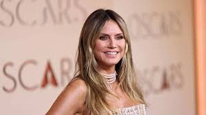 Heidi Klum, 53, turns up the heat in tiny sequin bikini on boat