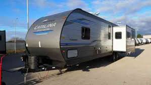 Rugged construction, beautiful fabrics, ease of operation and affordability combine to make the 8500 the best manual awning in the world. Coachmen Catalina 303rkp Rear Kitchen Travel Trailer With Vans Suvs And Trucks Cars