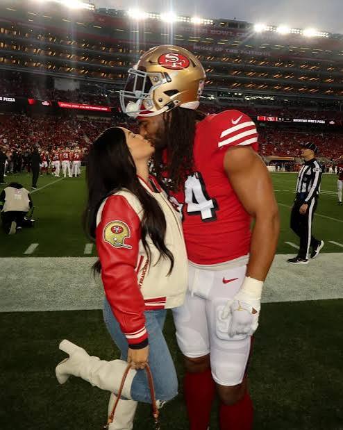 San Francisco 49ers' Fred Warner's wife, Sydney, dresses him for game days