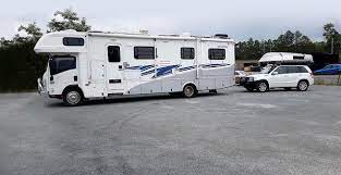 Many rvers tow a smaller vehicle behind their rv for the convenience that an extra set of wheels provide. Rv Daily The Truth About Flat Towing Behind An Rv Hardware You Need