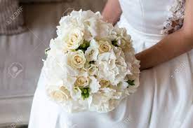 Wedding bouquets with white roses hrdrangeas. Exquisite Bridal Bouquet Of White Roses Hydrangeas And Freesia In The Hands Of An Unrecognizable Bride Stock Photo Picture And Royalty Free Image Image 122942796