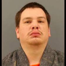 Charges: Cash, stolen gun found after man shot at driver