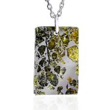 Mincy resembles the other meteorites in this case because it is a mixture of stone and iron. Stony Iron Meteorite Pendant
