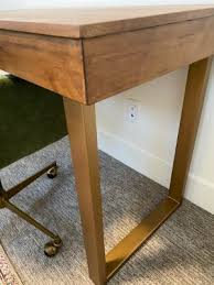 Lastly, world market carries just over 130+ different models of coffee tables and accent tables that feature styles such as carved wooden tables, console tables with storage, glass tables with gold metal, quartz drink tables, hexagon shaped tables, hammered metal tables, floral tray tables, marble tables, multi level tables and more! Wood And Gold Metal Sloan Desk World Market