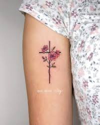 A small cross tattoo design on middle finger. Cross Tattoos For Women 18 Tattoo Designs For Women