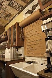 One Shot Coffee Crafting History Through Interior Design Rustic Coffee Shop Coffee Shop Coffee Shop Design