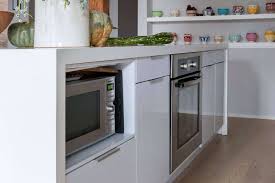 Options include building the microwave into cabinetry, installing it inside an island, recessing the unit into the wall, and more. 11 Strategies For Hiding The Microwave Remodelista