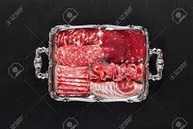 An antipasti platter is probably the most iconic italian appetizer, and for good reason: Assortment Of Different Sliced Meat Snacks Serving Cold Italian Appetizers On A Silver Tray On Black Natural Stone From Slate Stock Photo Picture And Royalty Free Image Image 85637757