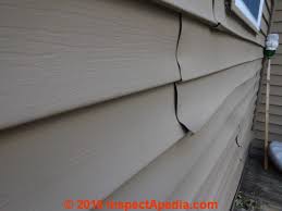 Many cases of bad warping occur during the summer. Vinyl Siding Buckled Warped By Sun Exposure