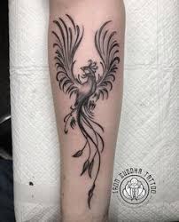 He has pointed ears and fangs. 37 Tattoos Ideas Tattoos Phoenix Bird Tattoos Phoenix Tattoo Design