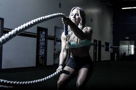 A Woman Working Out In The Gym Health Hd Wallpaper Fitness Model Fitness Wallpaper Workout Motivation Music