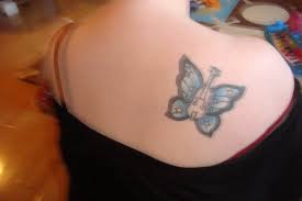 Butterfly with flowers tattoo butterfly tattoo cover up butterfly tattoo on shoulder butterfly pretty tattoos beautiful tattoos cool tattoos tatoos dream tattoos awesome tattoos neue tattoos body art tattoos cowgirl tattoos. Nyc S Best Tattoo Cover Up Artist Adal Majestic Tattoo Nyc