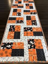 Maybe you would like to learn more about one of these? Quilted Halloween Table Runner Trick Or Treat Fabrics Cream Orange Black Nostalgic Decor Halloween Table Runners Quilted Table Runners Patterns Quilted Table Runners