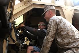 File:U. S. Marine Cpl. Eric Barner with Combat Logistics Regiment-27, 2nd  Marine Logistics Group educates a student from Bitz Intermediate School  about a MRAP All Terrain Vehicle for Career Day