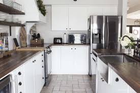 Farmhouse white kitchen with black appliances. Our New Black Stainless Steel Appliances Features We Adore