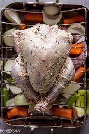 Bake turkey, uncovered, in the preheated oven until no longer pink at the bone and the juices run clear, about 3 hours. How To Truss A Turkey Video And Turkey Tips For Thanksgiving Fox And Briar