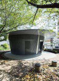 tadao ando creates circular public toilet surrounded by cherry trees in tokyo tadao ando toilet surround toilet design