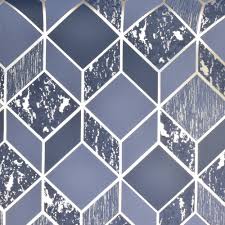 The contemporary design is made is of metallic gold geometric triangles on a matte navy blue background. Superfresco Vittorio Geo Navy Gold Wallpaper 107964 Allen Braithwaite
