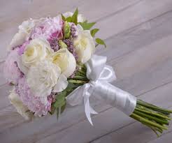 Adjust the flowers in the arrangement by pushing from the base of the stems until the bouquet feels balanced with a mixture of heights, and all the flowers show up well in the bouquet. Diy Bridal Bouquet 12 Steps With Pictures Instructables
