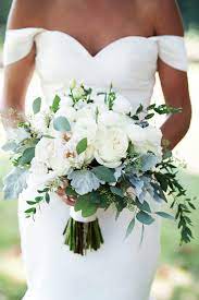 Look through magazines, books on floral decorating, visit fine floral shops, and take pictures set your flower budget: Some Criteria Such As The Model Of Your Wedding Dress The Theme Of Your Wedding Your H Greenery Wedding Bouquet Rose Wedding Bouquet Eucalyptus Wedding Decor
